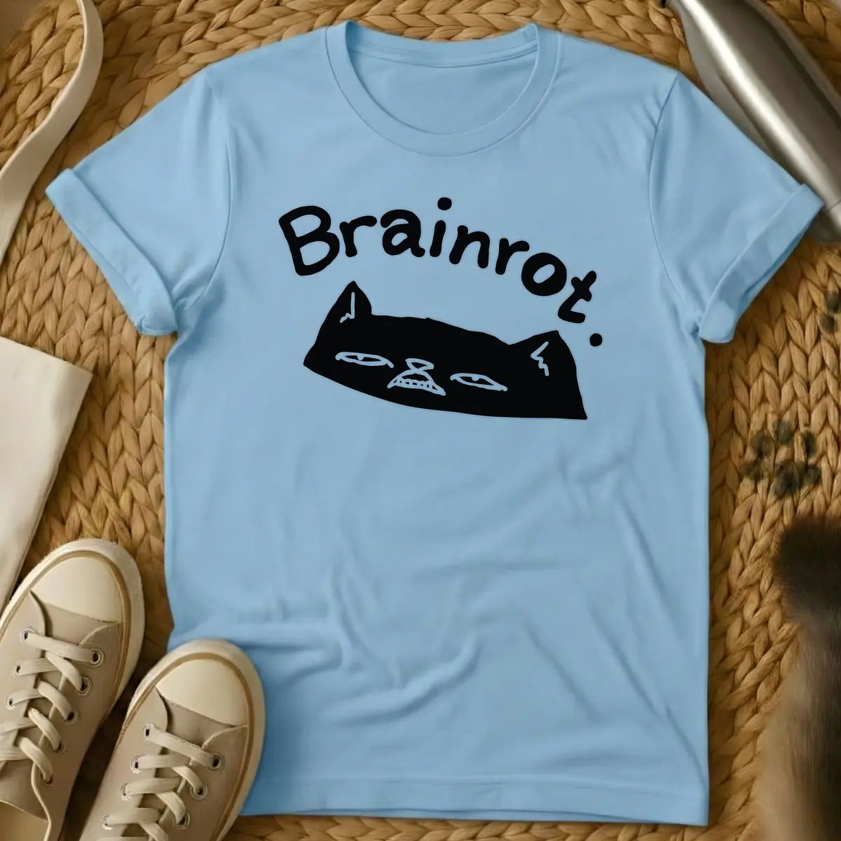 Light Blue - Text "Brainrot." in a quirky, handwritten font above a black cat's head with a grumpy expression, narrow eyes, and small fangs visible.