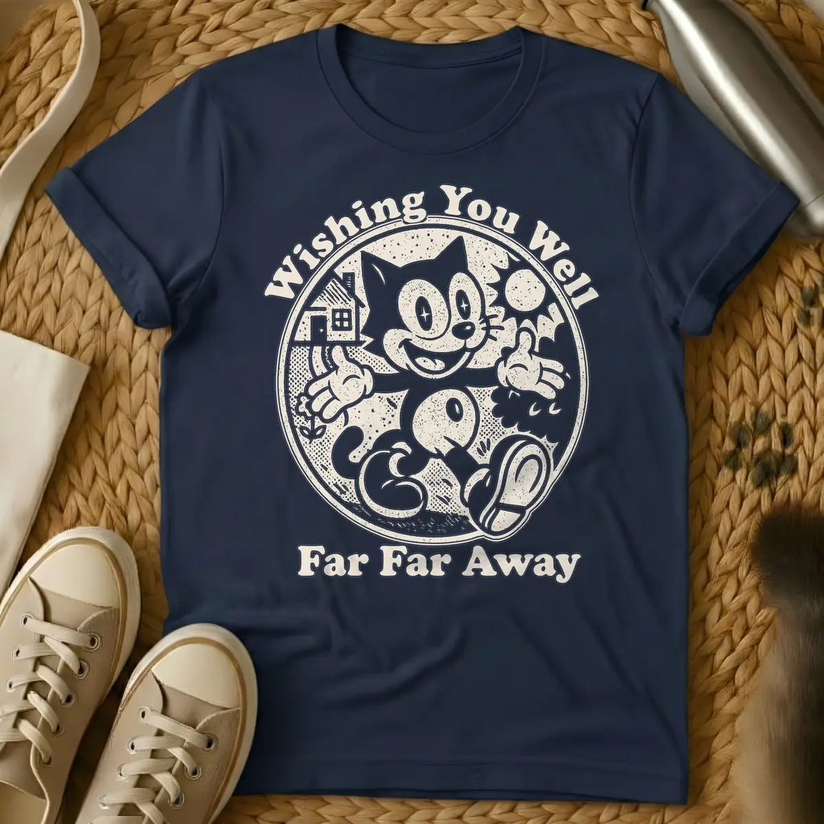 Navy - Dark blue distressed graphic of a vintage cartoon cat, similar to Felix, happily walking with thumbs up inside a circle. To its left is a house and small flower, to its right a sun. Text above reads "Wishing You Well", and text below reads "Far Far Away".