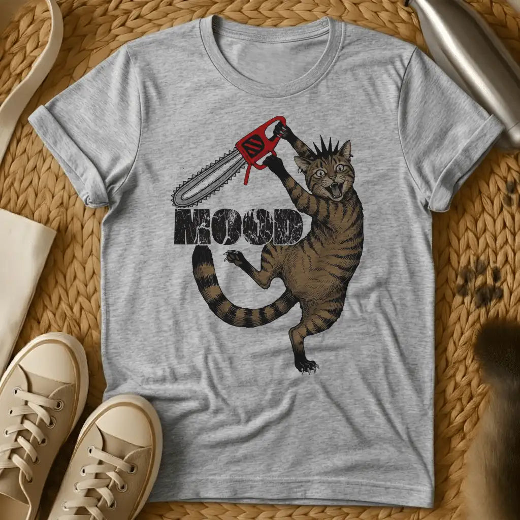 Sport Grey - Cartoon cat holding red chainsaw with "MOOD" text on olive green t-shirt, displayed flat lay with sneakers