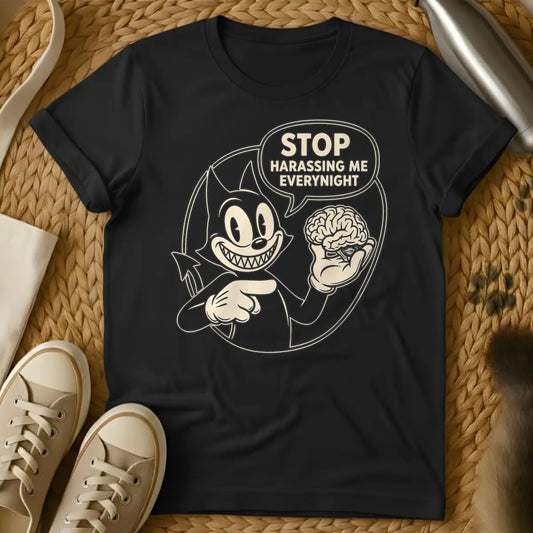 Black - Black and white vintage cartoon devil cat with a wide, sharp-toothed grin, holding a human brain in one hand and pointing at it, with a speech bubble that reads "STOP HARASSING ME EVERY NIGHT".