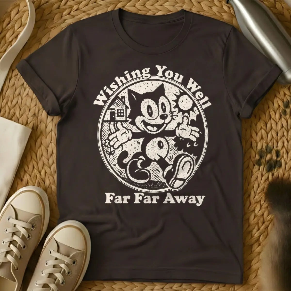 Dark Chocolate - Dark blue distressed graphic of a vintage cartoon cat, similar to Felix, happily walking with thumbs up inside a circle. To its left is a house and small flower, to its right a sun. Text above reads "Wishing You Well", and text below reads "Far Far Away".