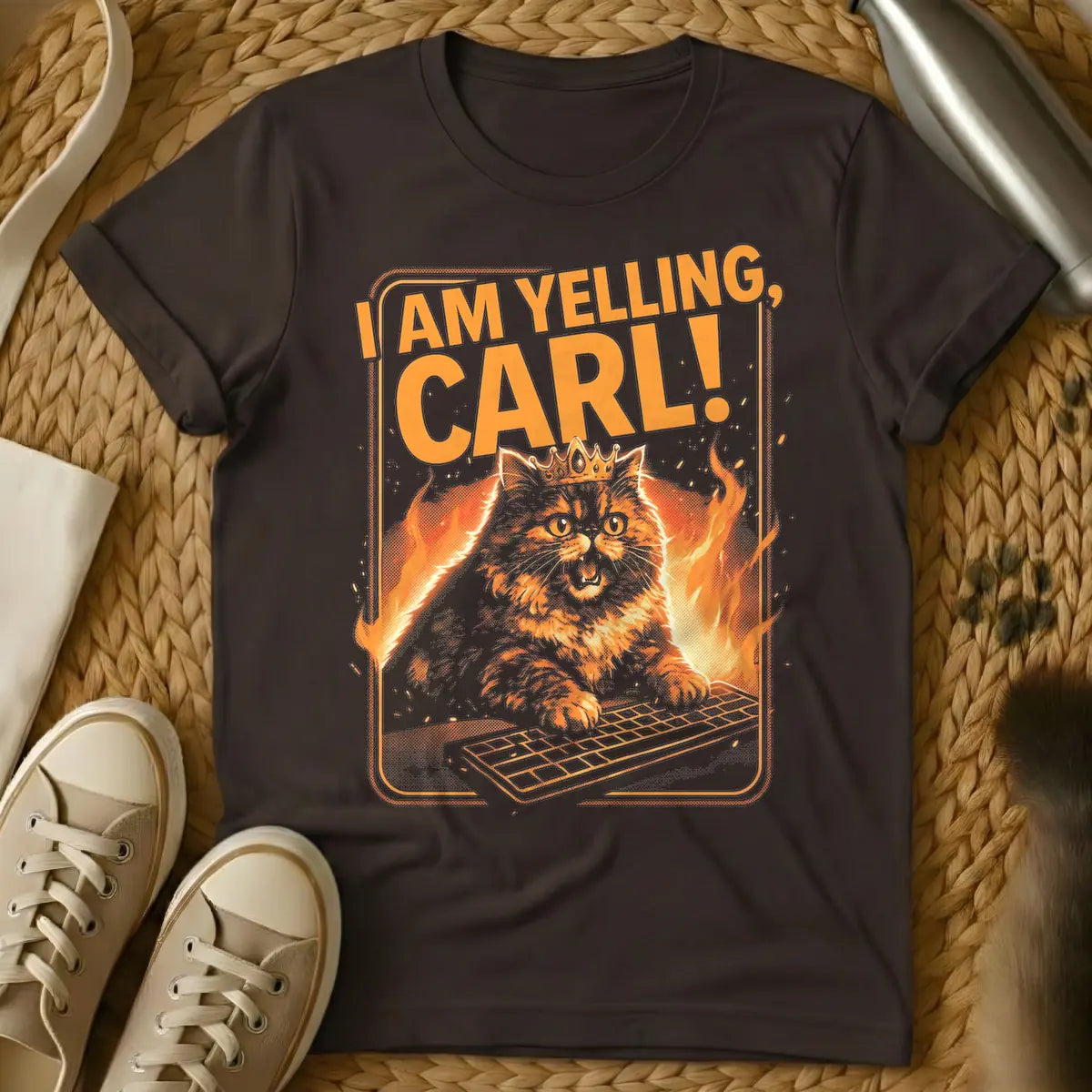 Dark Chocolate - Orange and black t-shirt design featuring a crowned, angry-looking cat with wide eyes and an open mouth, surrounded by flames, aggressively typing on a computer keyboard. Above the cat, the bold orange text reads "I AM YELLING, CARL!"
