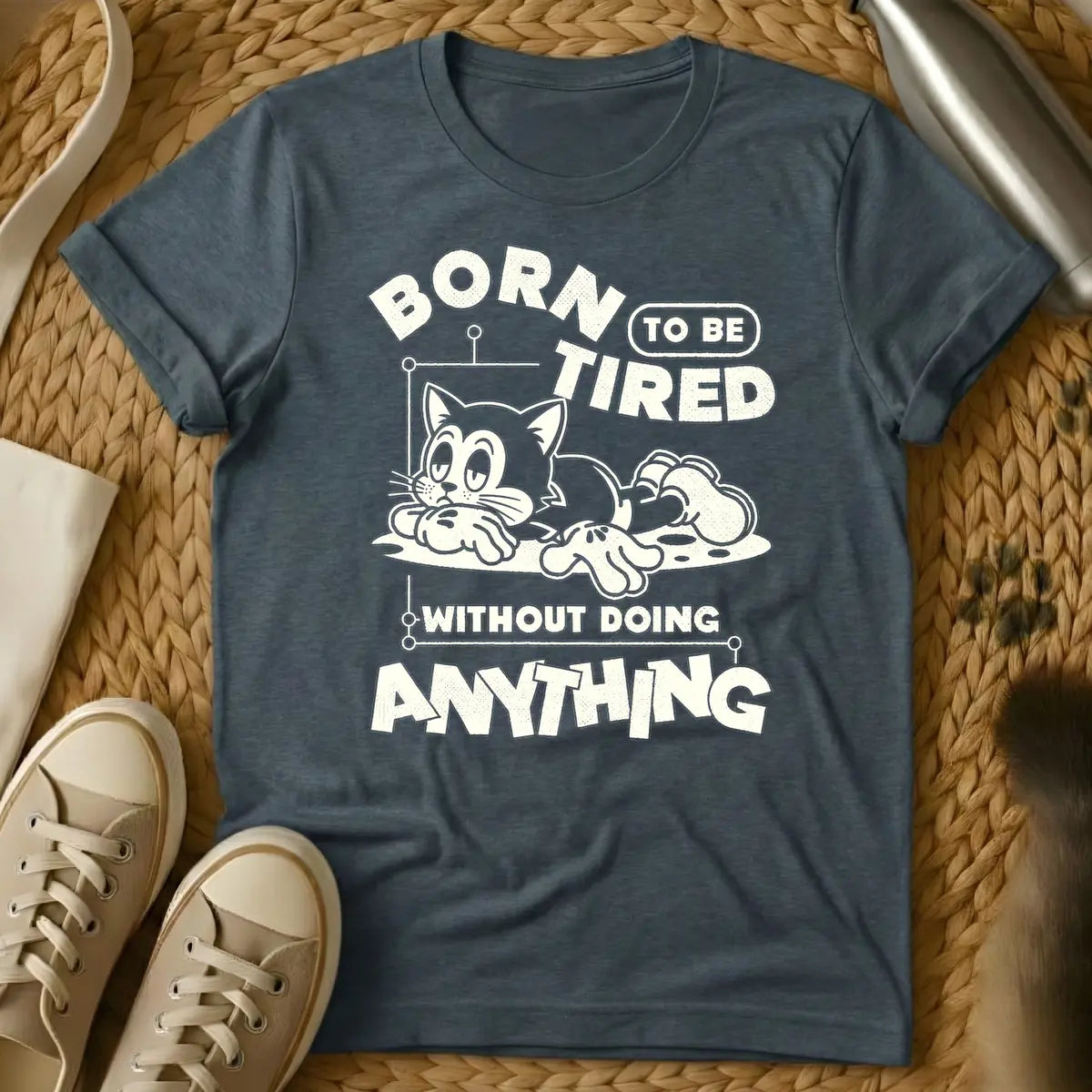Dark Heather - Distressed cream t-shirt design featuring a tired-looking cartoon cat lying down and the text 'BORN TO BE TIRED WITHOUT DOING ANYTHING'.
