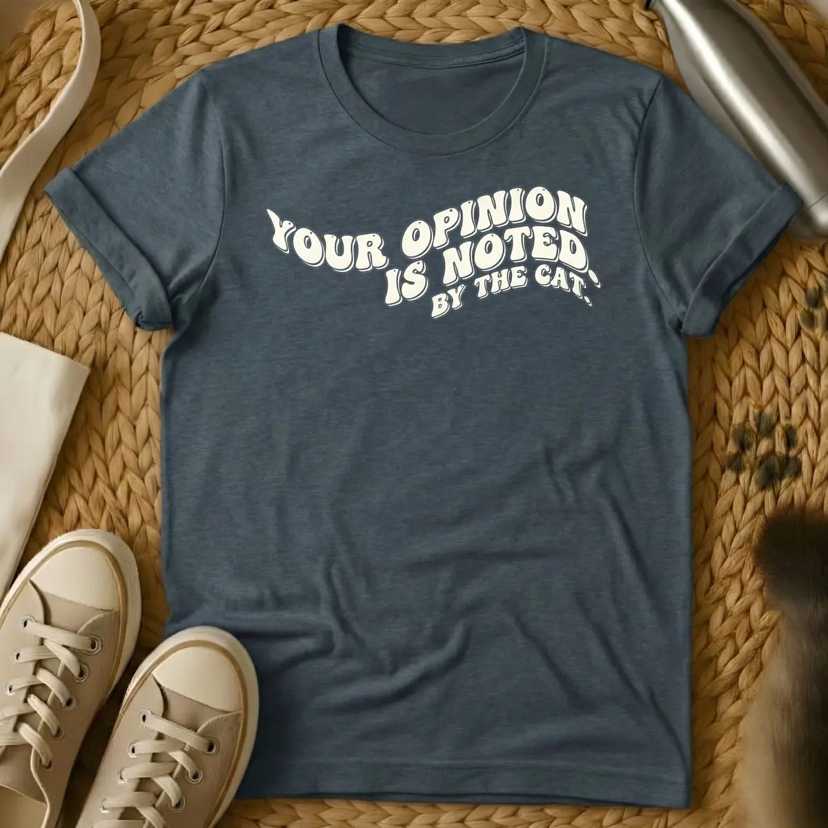 Dark Heather - T-shirt design featuring the phrase "YOUR OPINION IS NOTED BY THE CAT." in a cream, bubbly retro font.