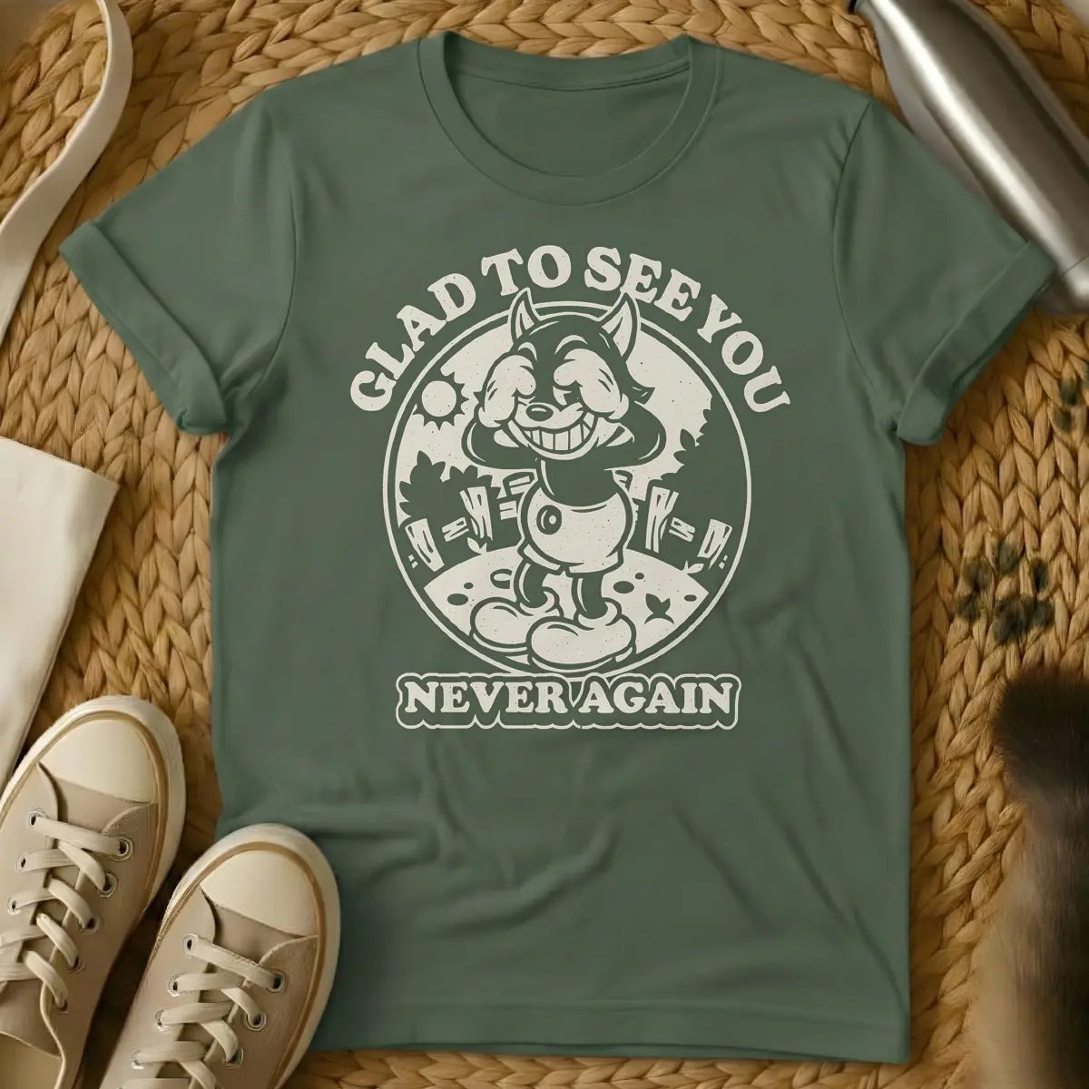 Military Green - Vintage style cartoon wolf character covering its eyes with its hands and grinning widely, in a circular frame with a sun and fence in the background. Arched text above the circle reads "GLAD TO SEE YOU", and text below the circle reads "NEVER AGAIN".