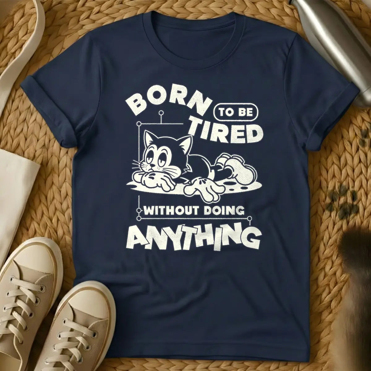 Navy - Distressed cream t-shirt design featuring a tired-looking cartoon cat lying down and the text 'BORN TO BE TIRED WITHOUT DOING ANYTHING'.