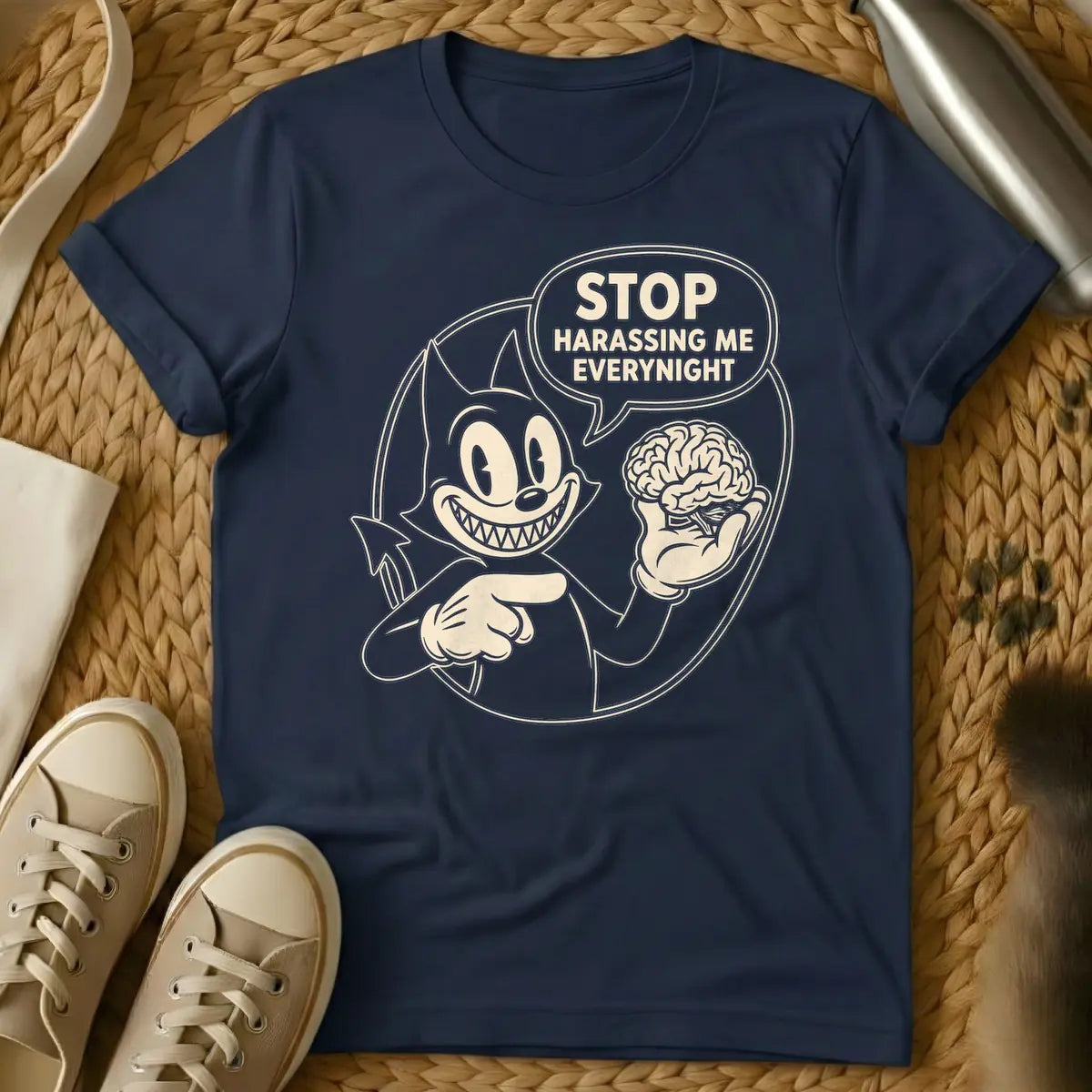 Navy - Black and white vintage cartoon devil cat with a wide, sharp-toothed grin, holding a human brain in one hand and pointing at it, with a speech bubble that reads "STOP HARASSING ME EVERY NIGHT".