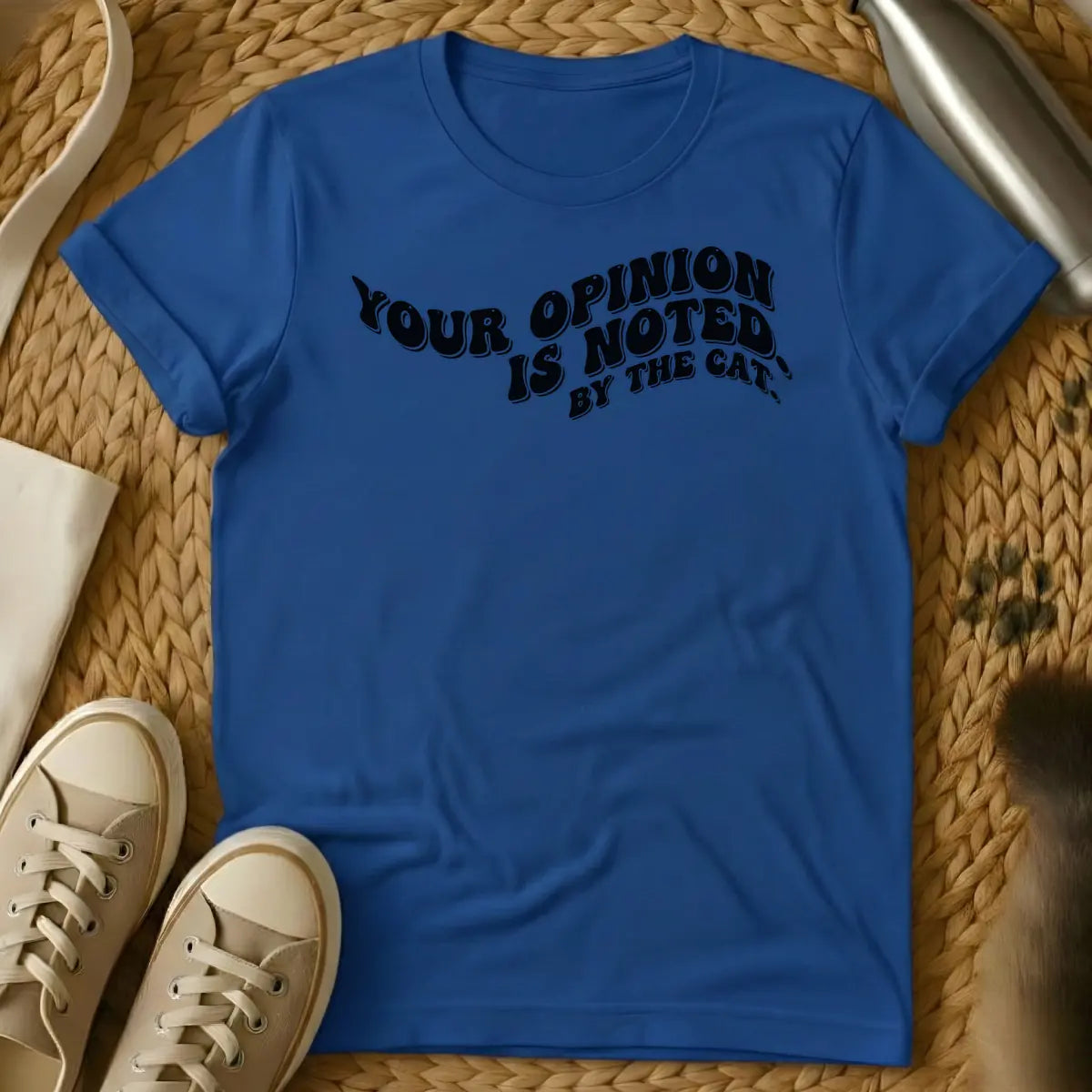 Royal - T-shirt design featuring the phrase "YOUR OPINION IS NOTED BY THE CAT." in a cream, bubbly retro font.