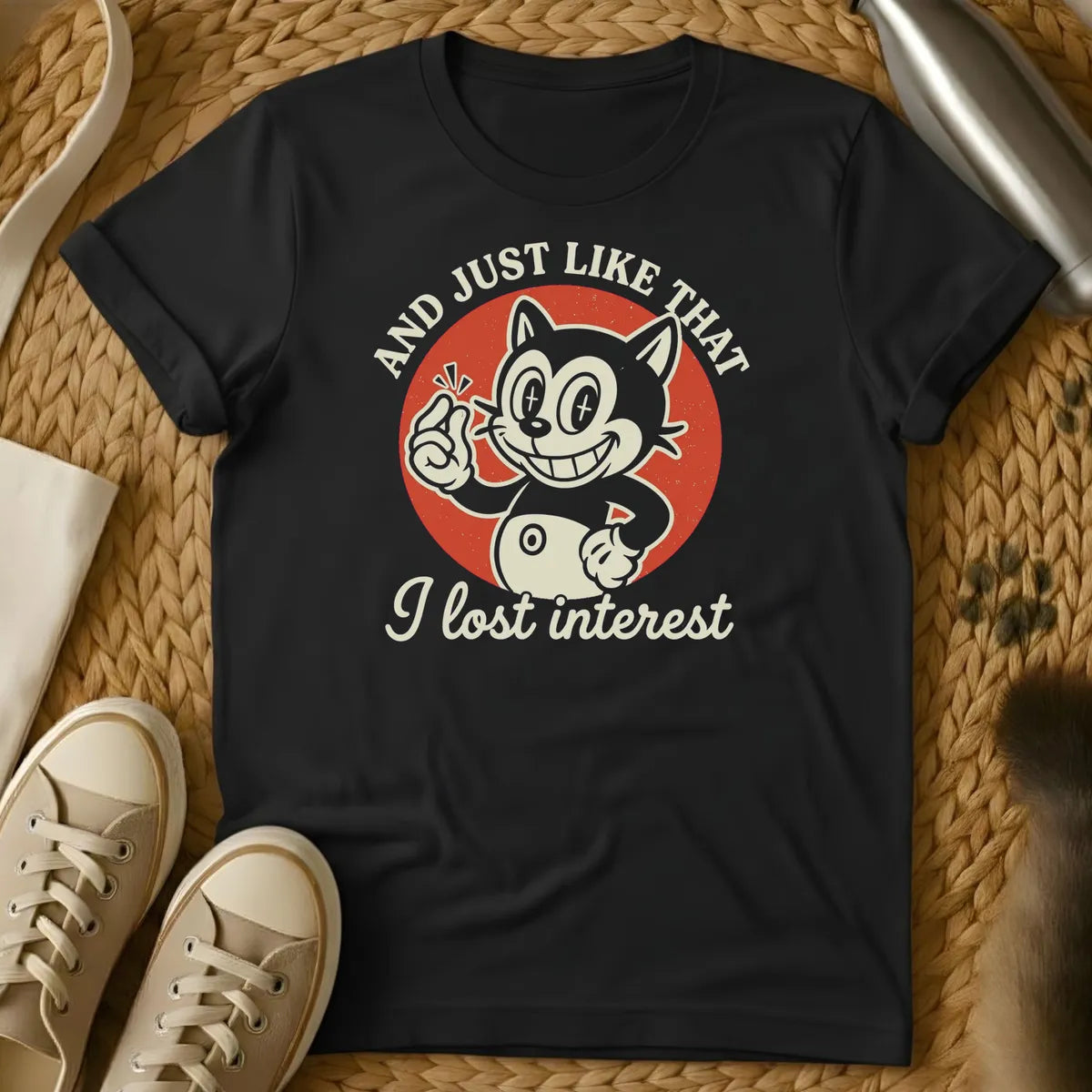 Black - Dark heather t-shirt with vintage rubber-hose cartoon grinning cat snapping fingers on red circle, text reads And Just Like That I Lost Interest