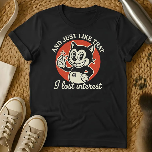 Black - Dark heather t-shirt with vintage rubber-hose cartoon grinning cat snapping fingers on red circle, text reads And Just Like That I Lost Interest