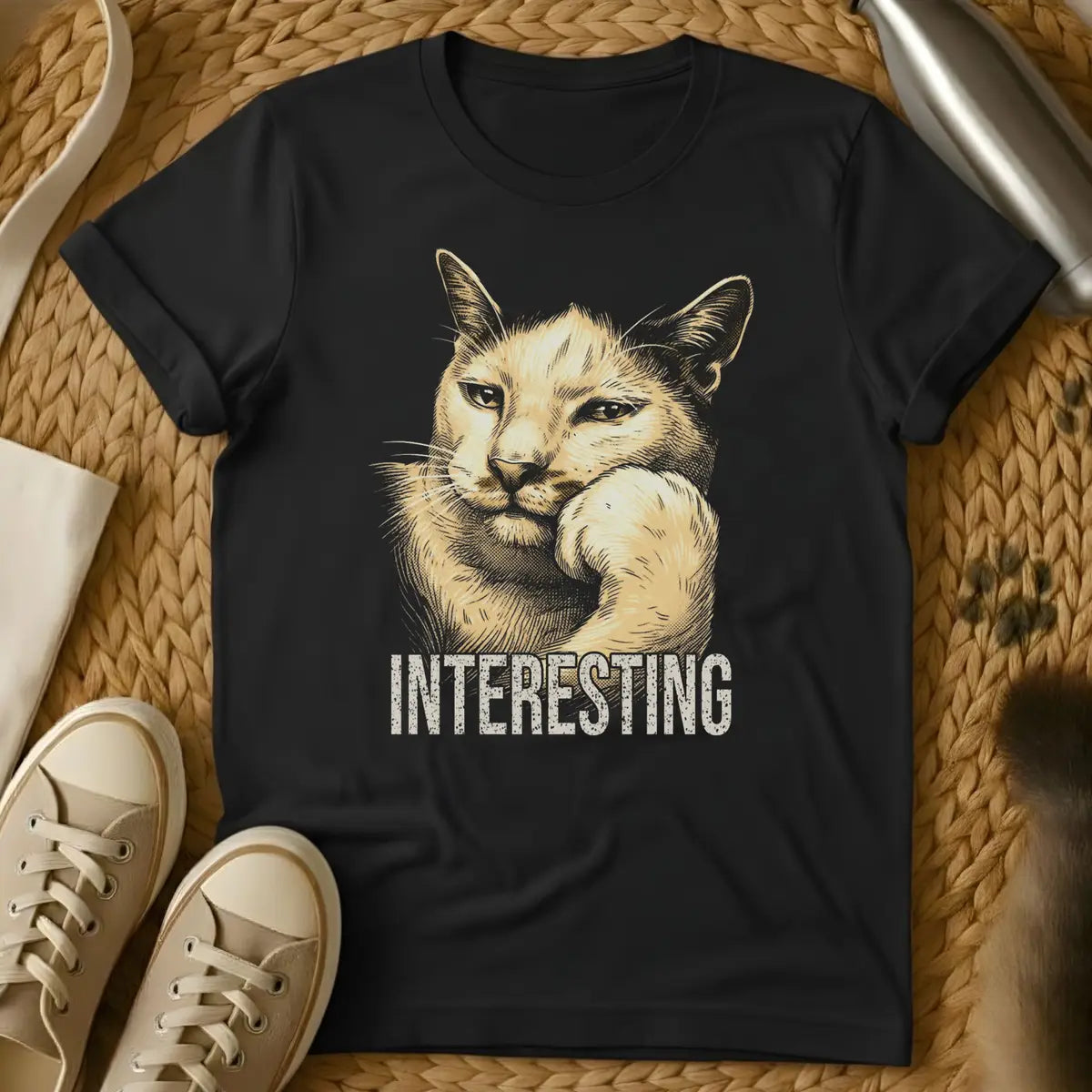 Black - Dark heather t-shirt with vintage engraving-style illustration of a cat resting chin on paw and the word INTERESTING below