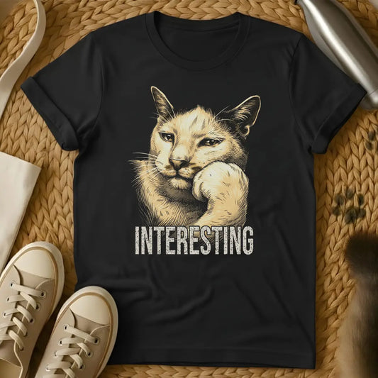 Black - Dark heather t-shirt with vintage engraving-style illustration of a cat resting chin on paw and the word INTERESTING below