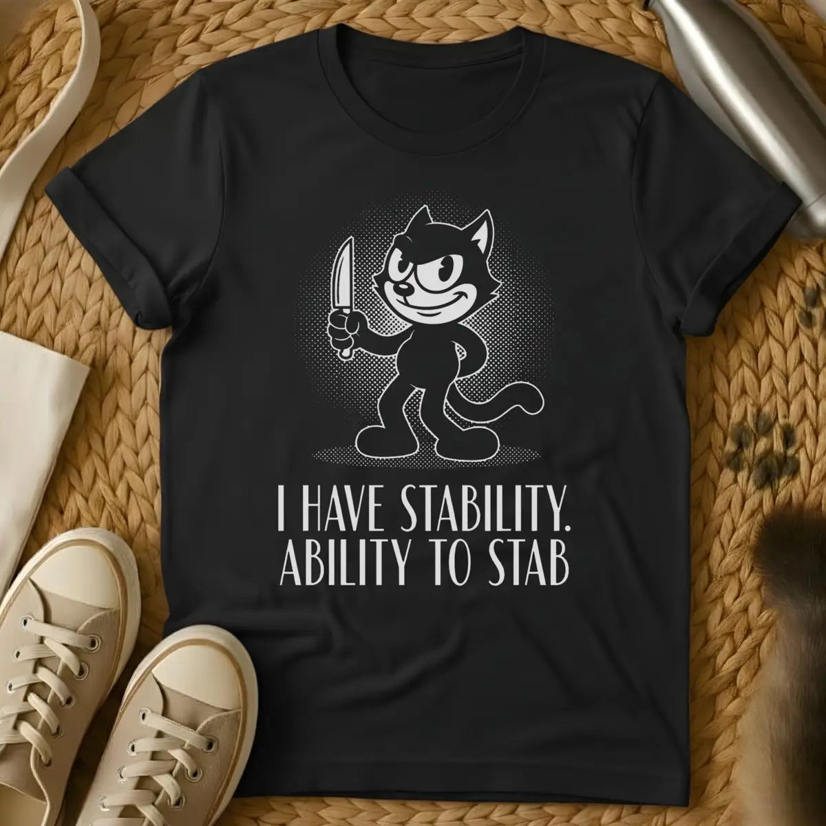 Black - Dark gray t-shirt featuring a retro cartoon cat character holding a knife with text reading "I HAVE STABILITY. ABILITY TO STAB