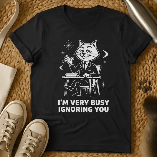 Black - Black t-shirt with vintage cartoon cat at desk design and text reading "I'm Very Busy Ignoring You