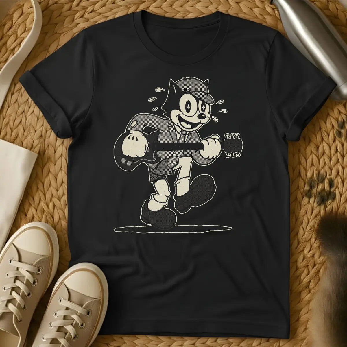 Black - Dark brown t-shirt with a cream retro 1930s cartoon cat in a newsboy cap and suit playing electric guitar mid-stride