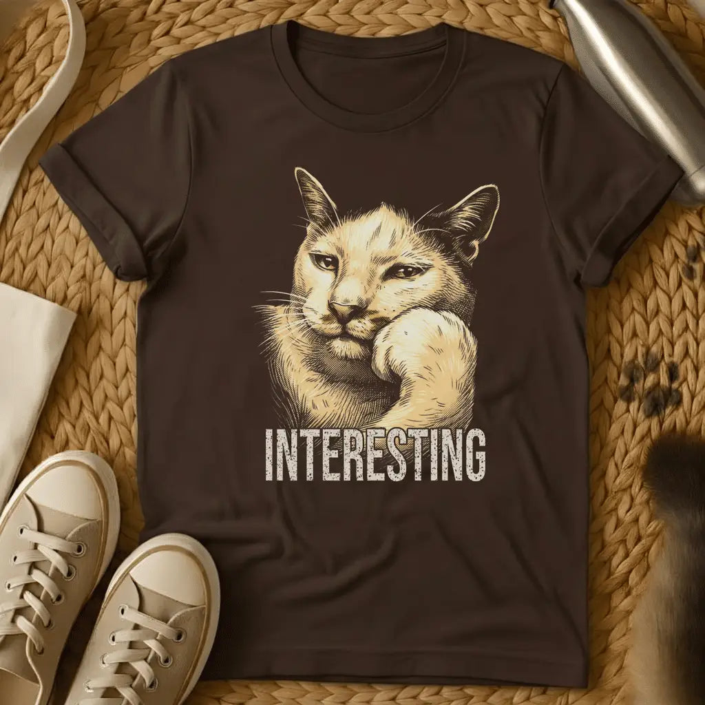 Dark Chocolate - Dark heather t-shirt with vintage engraving-style illustration of a cat resting chin on paw and the word INTERESTING below
