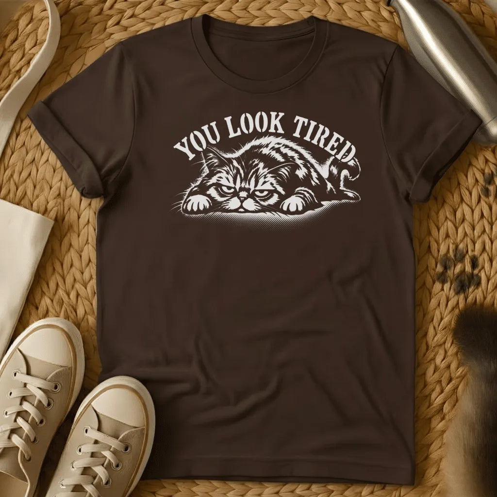 Dark Chocolate - Dark heather grey t-shirt with a grumpy lounging cat woodcut illustration and arched text reading You Look Tired