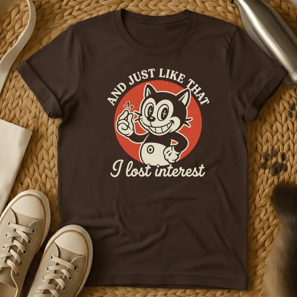 Dark Chocolate - Dark heather t-shirt with vintage rubber-hose cartoon grinning cat snapping fingers on red circle, text reads And Just Like That I Lost Interest