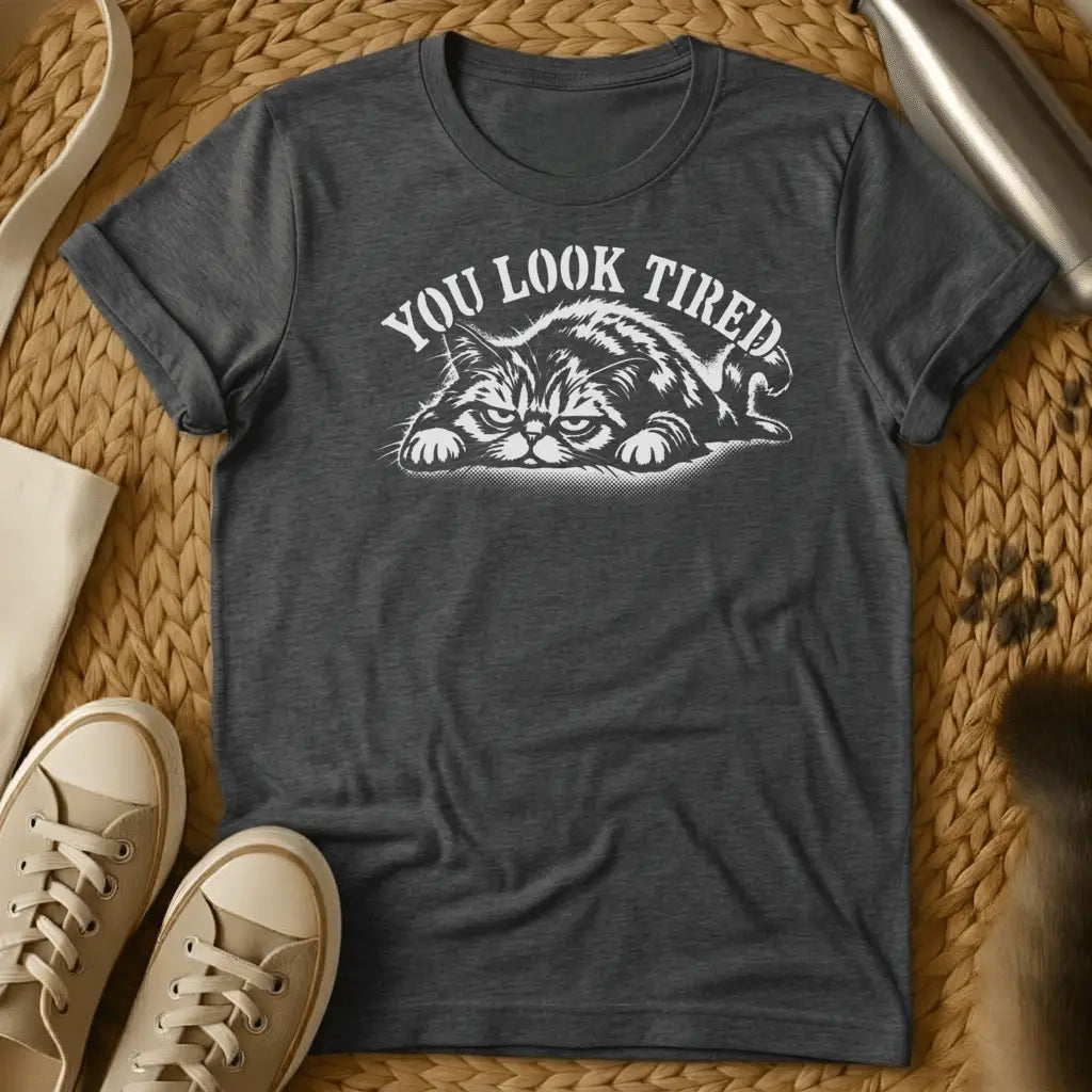 Dark Heather - Dark heather grey t-shirt with a grumpy lounging cat woodcut illustration and arched text reading You Look Tired