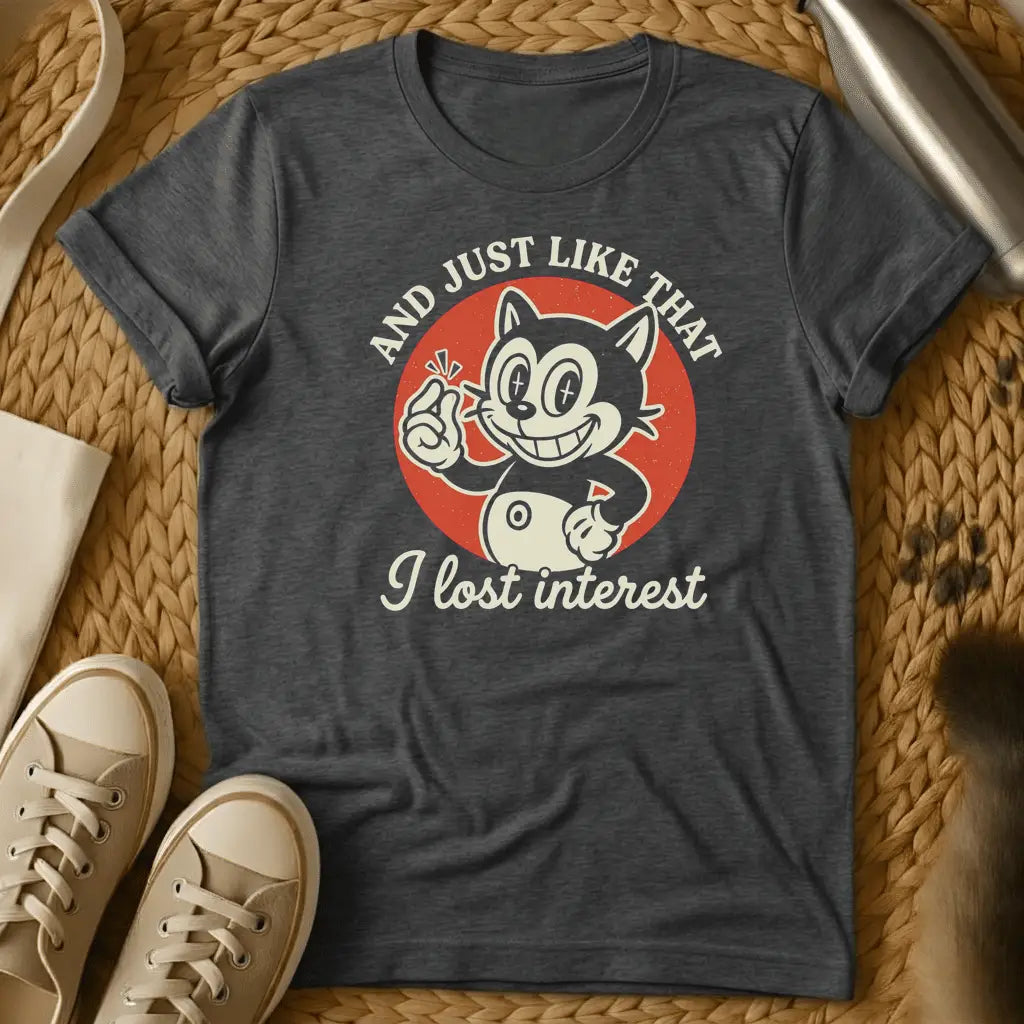 Dark Heather - Dark heather t-shirt with vintage rubber-hose cartoon grinning cat snapping fingers on red circle, text reads And Just Like That I Lost Interest