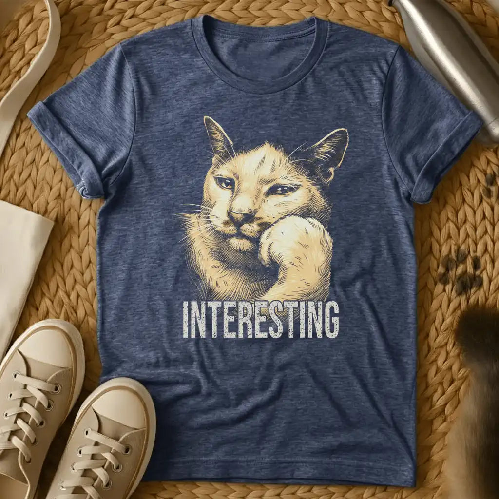 Heather Navy - Dark heather t-shirt with vintage engraving-style illustration of a cat resting chin on paw and the word INTERESTING below