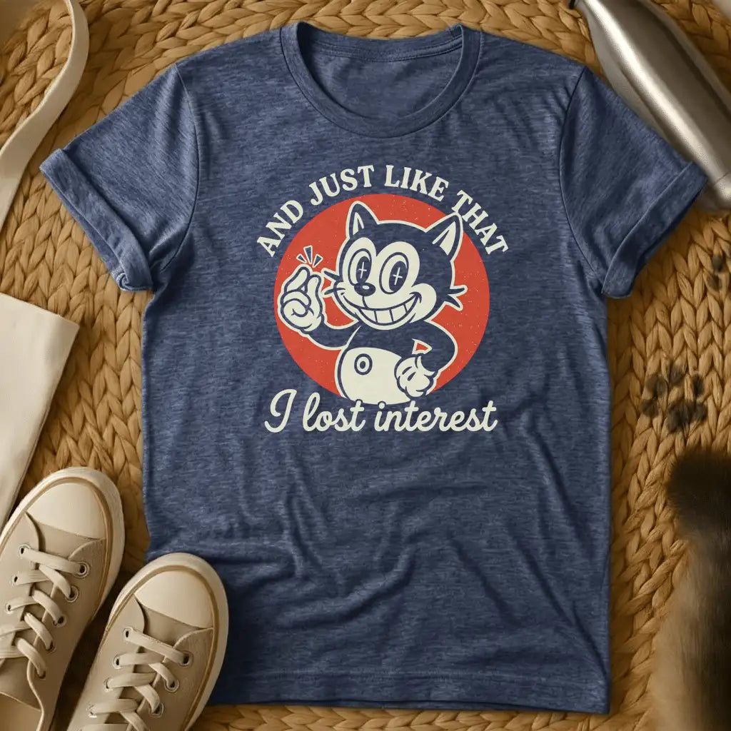 Heather Navy - Dark heather t-shirt with vintage rubber-hose cartoon grinning cat snapping fingers on red circle, text reads And Just Like That I Lost Interest