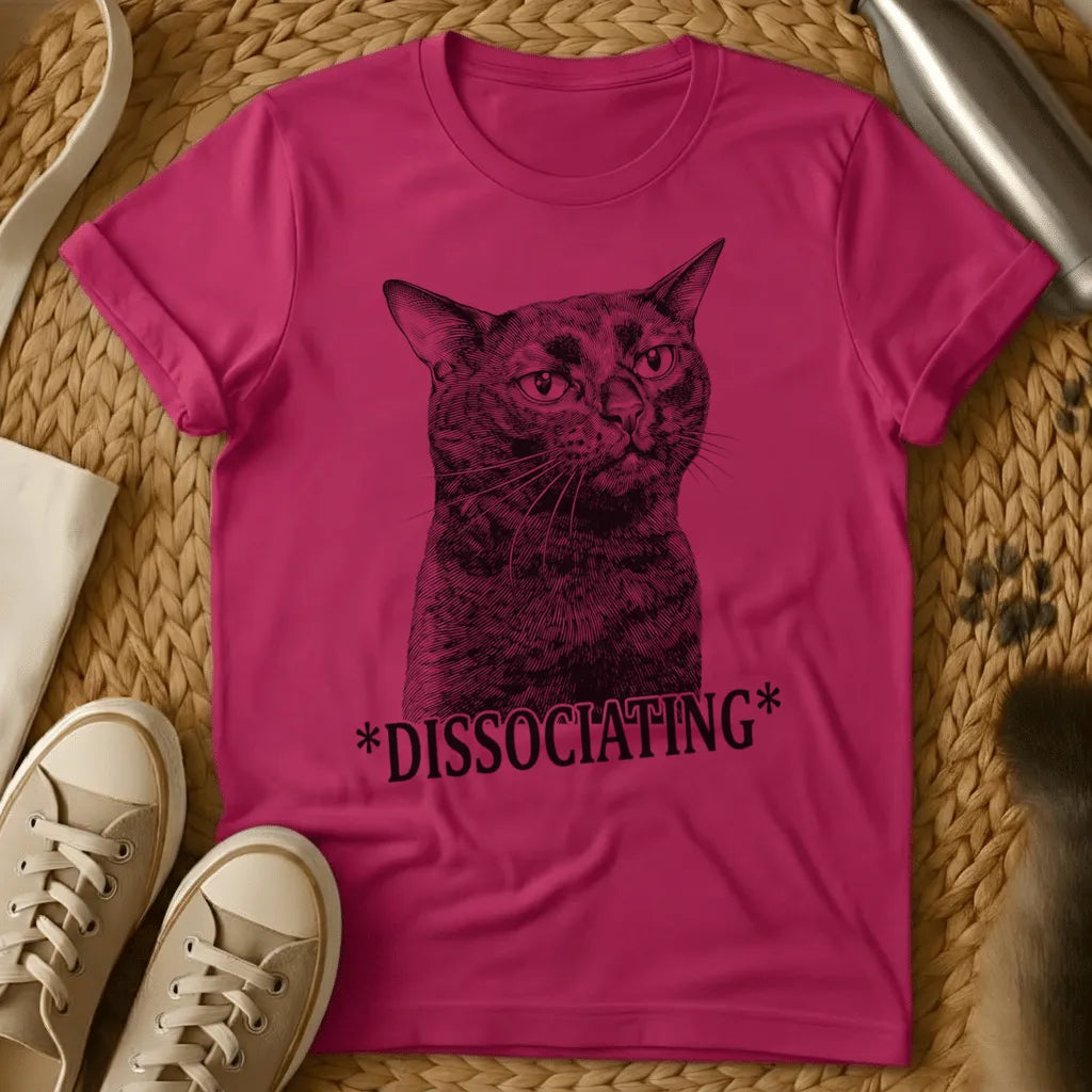Heliconia - Olive green t-shirt with vintage engraving of a blank-staring cat and the text *DISSOCIATING* below it