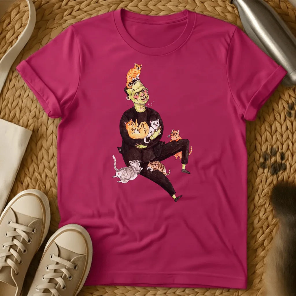 Heliconia - Frankenstein's monster juggling colorful cats on a sage green t-shirt with whimsical cartoon illustration style