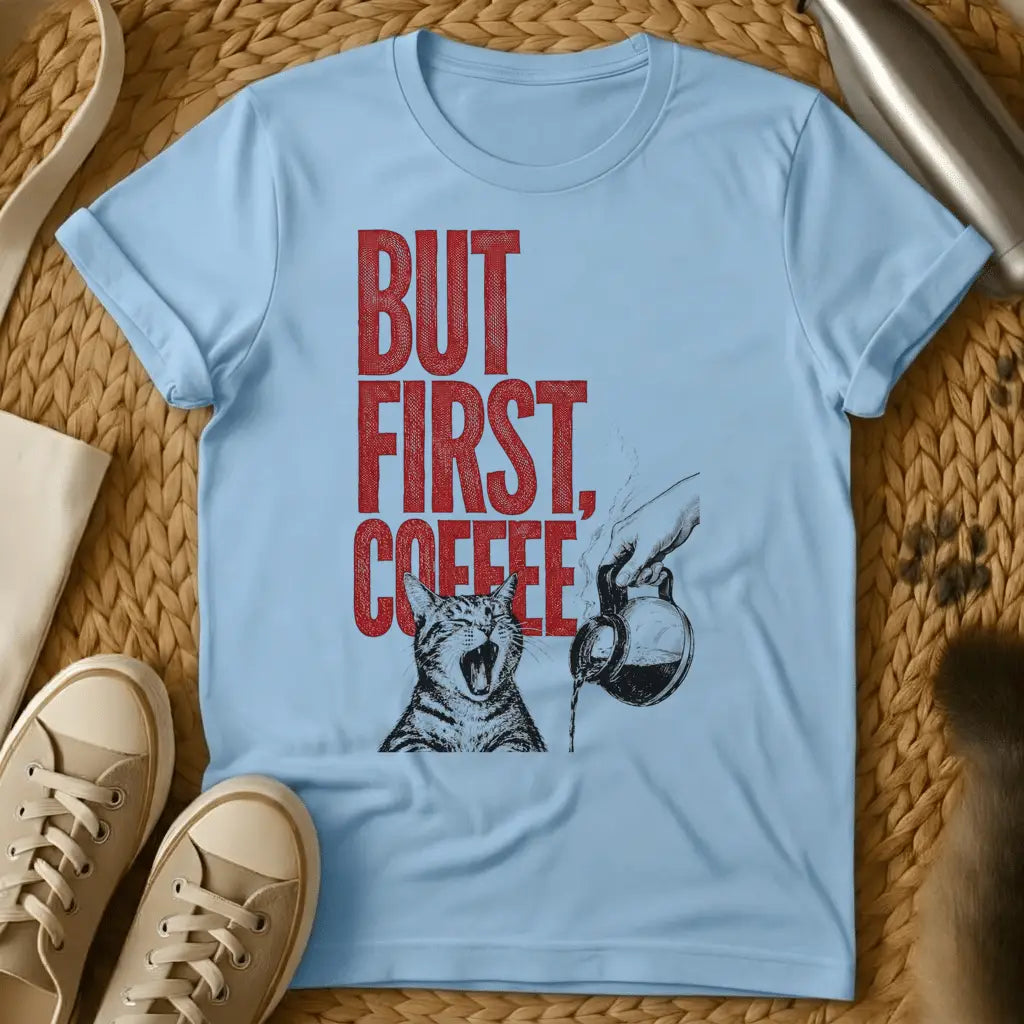 Light Blue - Light blue t-shirt with a screaming tabby cat and coffee carafe illustration and red distressed But First Coffee text