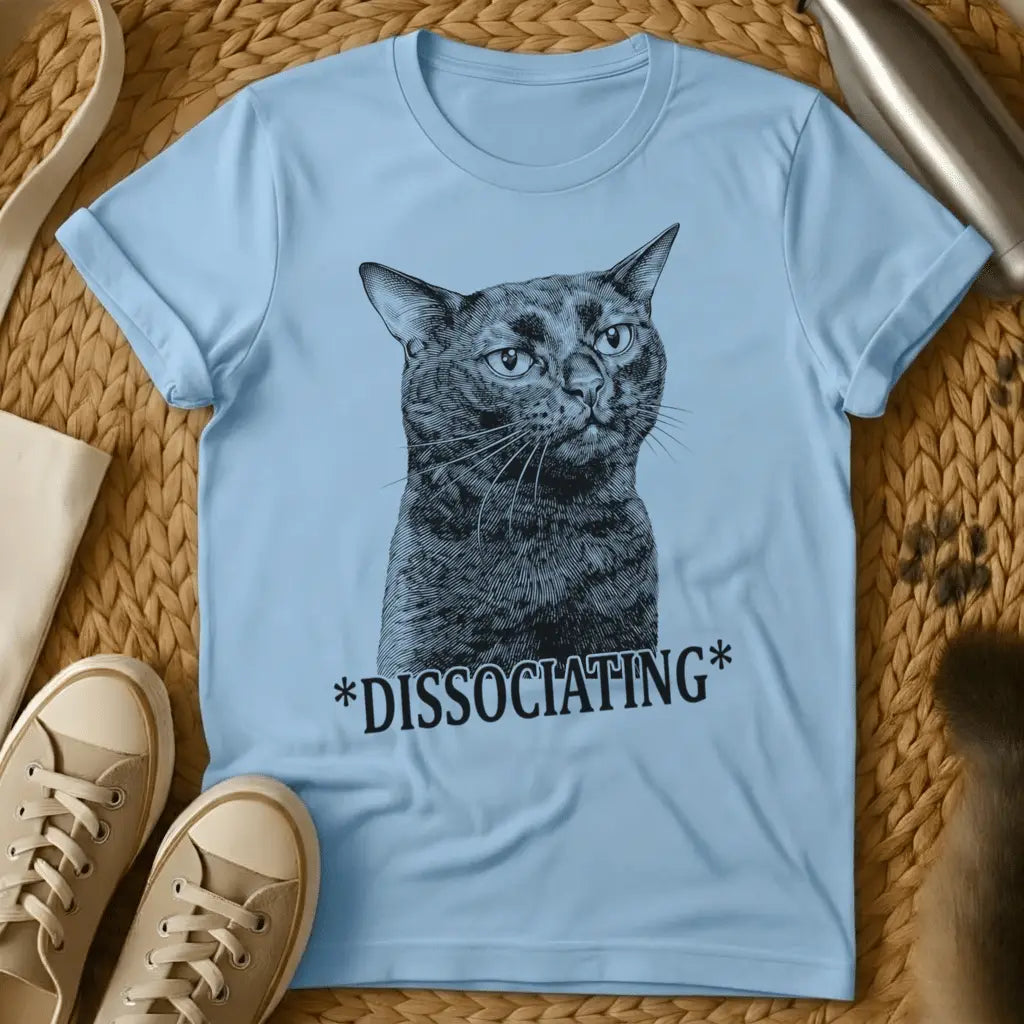 Light Blue - Olive green t-shirt with vintage engraving of a blank-staring cat and the text *DISSOCIATING* below it