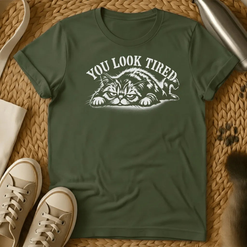 Military Green - Dark heather grey t-shirt with a grumpy lounging cat woodcut illustration and arched text reading You Look Tired