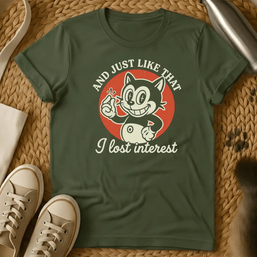 Military Green - Dark heather t-shirt with vintage rubber-hose cartoon grinning cat snapping fingers on red circle, text reads And Just Like That I Lost Interest