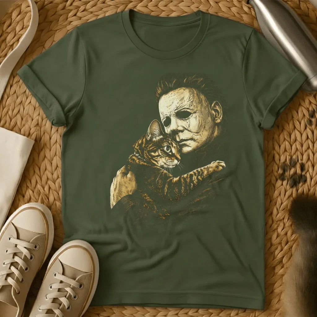 Military Green - Dark heather t-shirt with sepia etching of a blank-masked scarred figure tenderly cuddling a striped tabby kitten