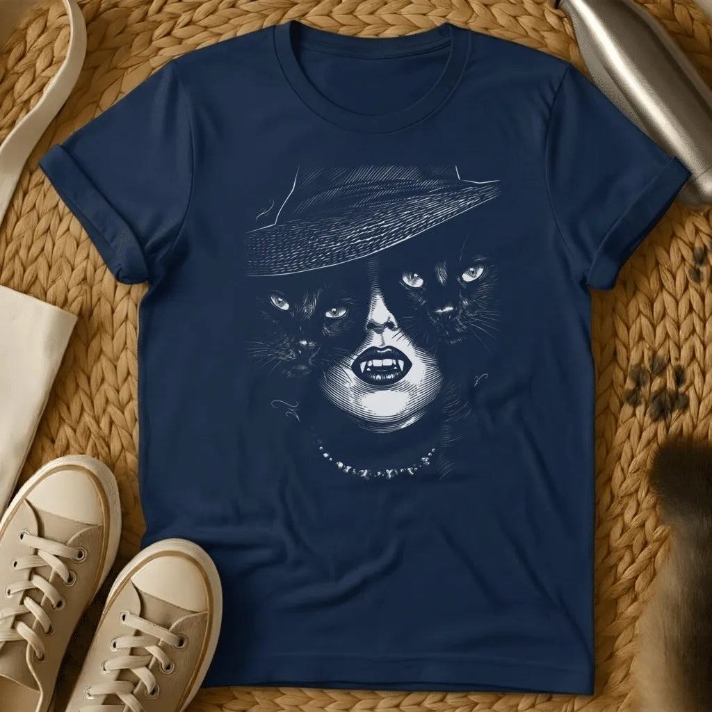 Navy - Navy t-shirt with surreal black and white illustration of a face wearing a wide-brimmed hat with two cat faces, featuring bold lips and a pearl neckla