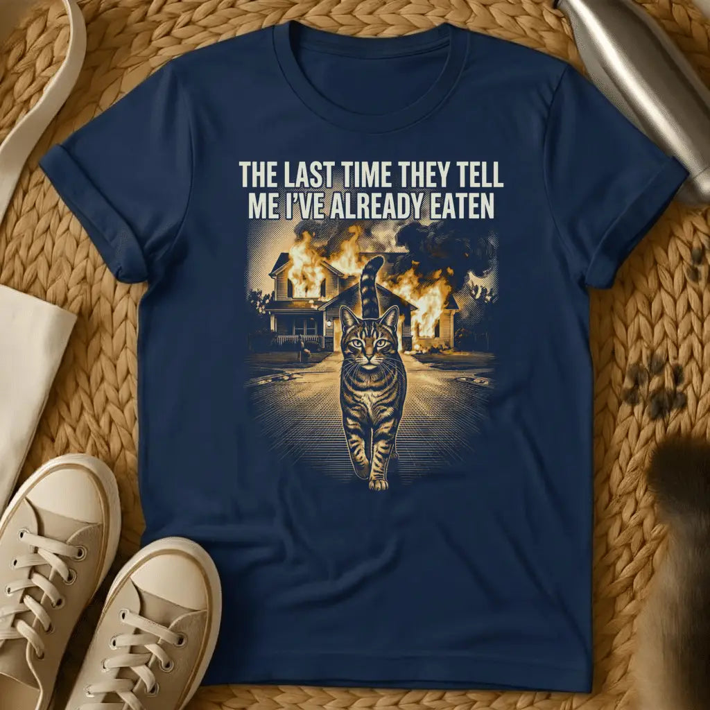 Navy - Black t-shirt with cat walking away from burning house and text "THE LAST TIME THEY TELL ME I'VE ALREADY EATEN" in humorous meme style