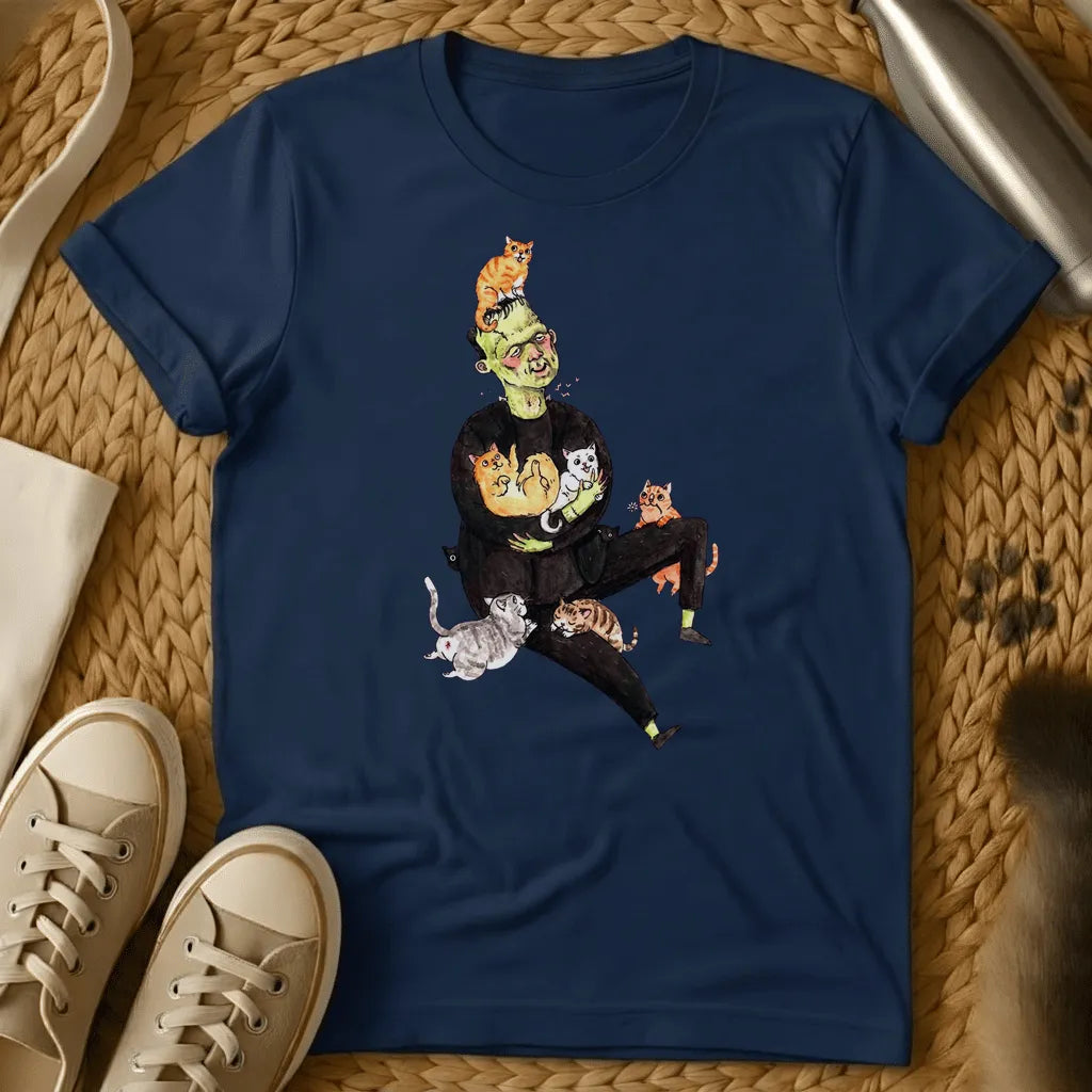 Navy - Frankenstein's monster juggling colorful cats on a sage green t-shirt with whimsical cartoon illustration style