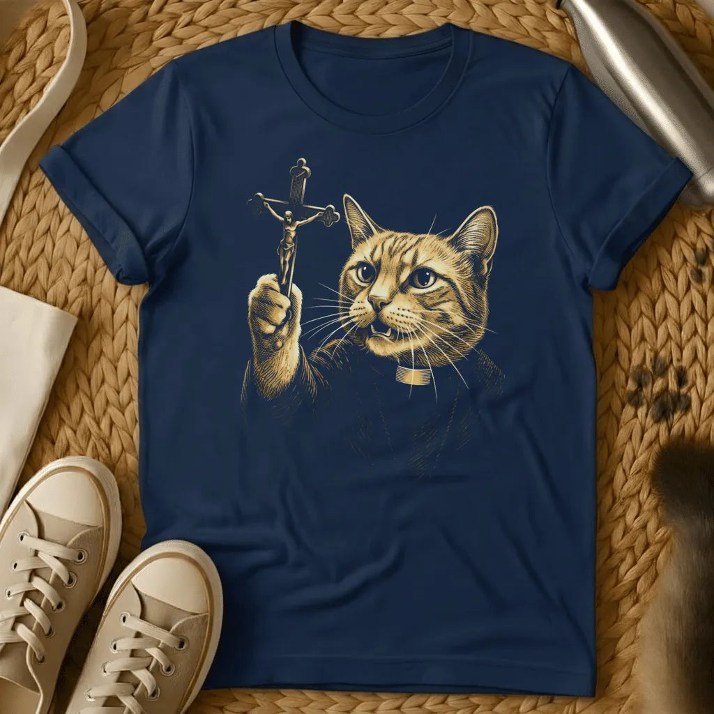 Navy - Cat holding crucifix with halo, gold religious artwork on charcoal gray t-shirt, flat lay styling