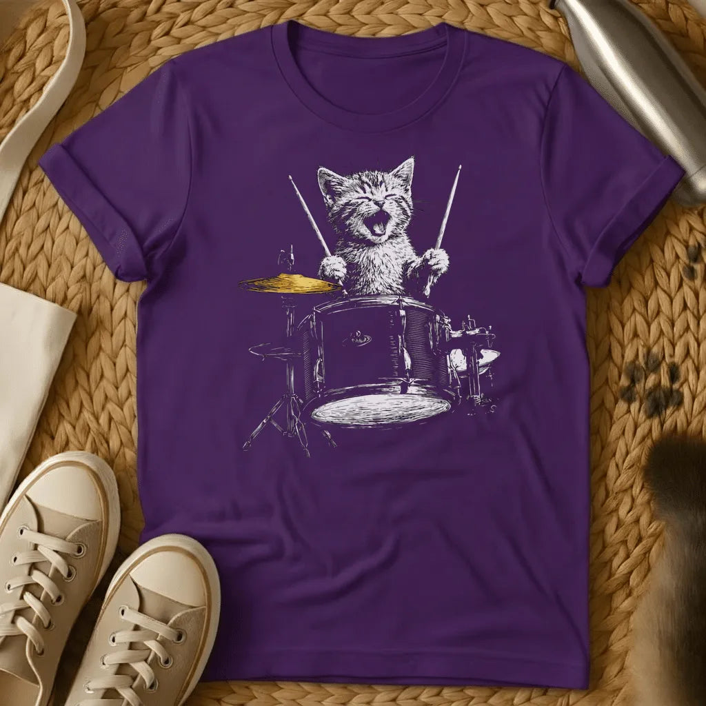 Purple - Forest green t-shirt with a sketch of a happy kitten playing a full drum kit with drumsticks, mouth open, cymbal mid-crash