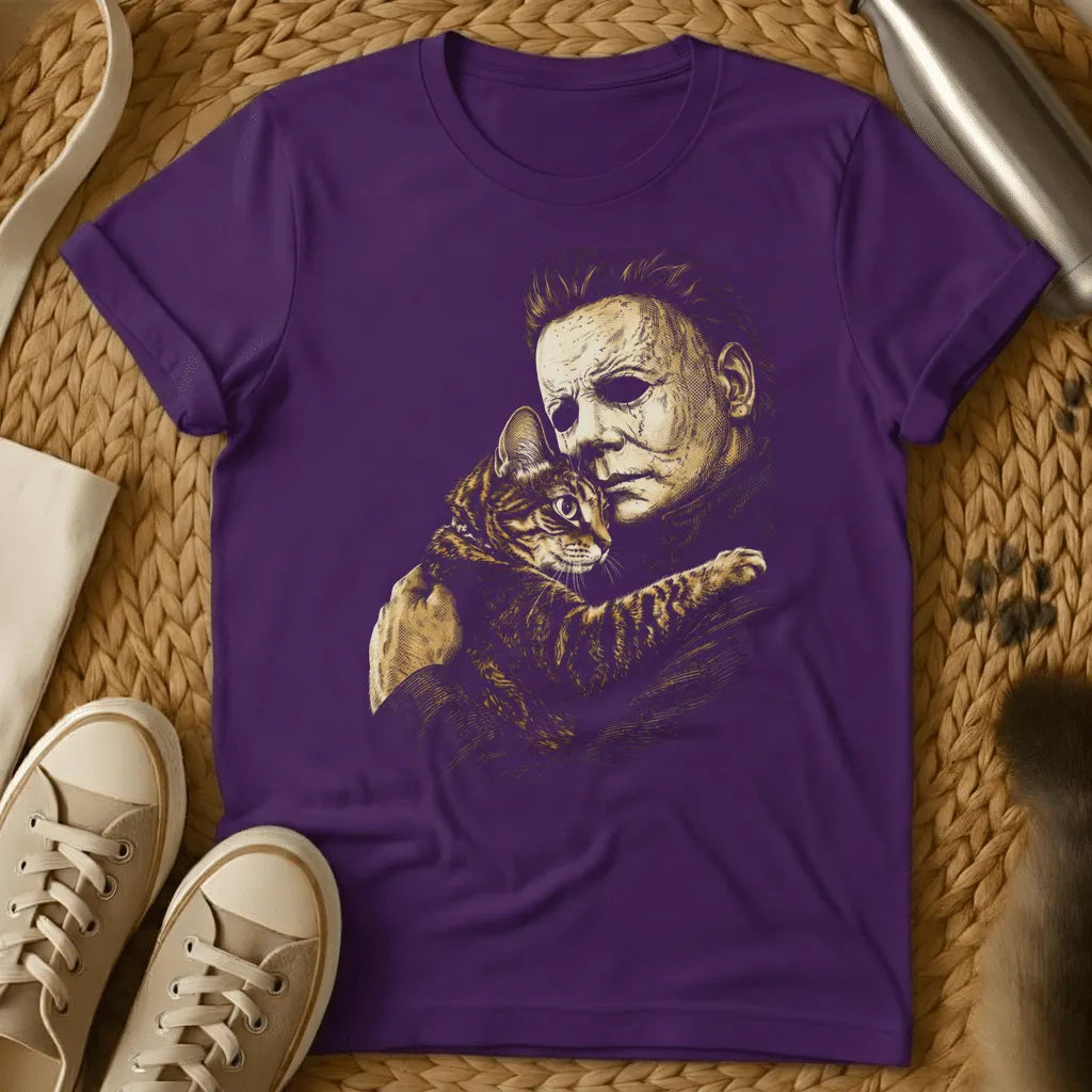 Purple - Dark heather t-shirt with sepia etching of a blank-masked scarred figure tenderly cuddling a striped tabby kitten
