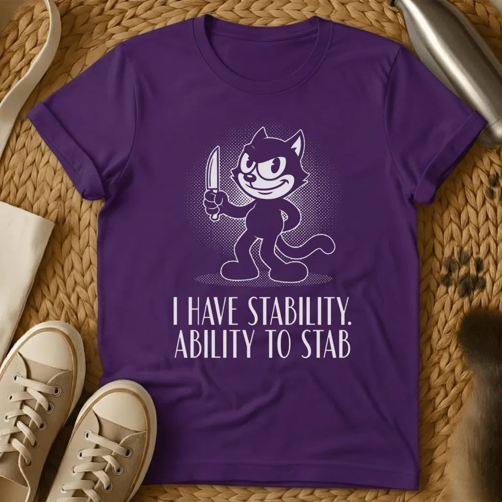 Purple - Dark gray t-shirt featuring a retro cartoon cat character holding a knife with text reading "I HAVE STABILITY. ABILITY TO STAB