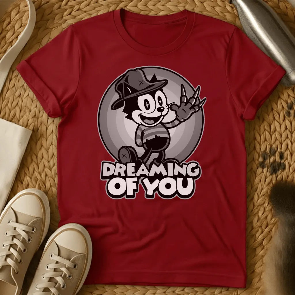 Red - Vintage cartoon cat in cowboy hat waving in front of moon with "Dreaming of You" text on sage green t-shirt
