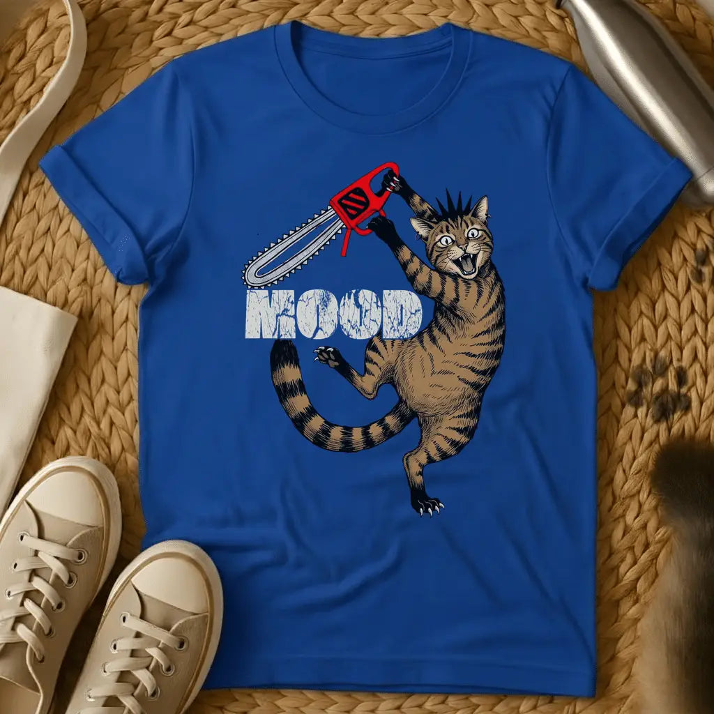Royal - Cartoon cat holding red chainsaw with "MOOD" text on olive green t-shirt, displayed flat lay with sneakers