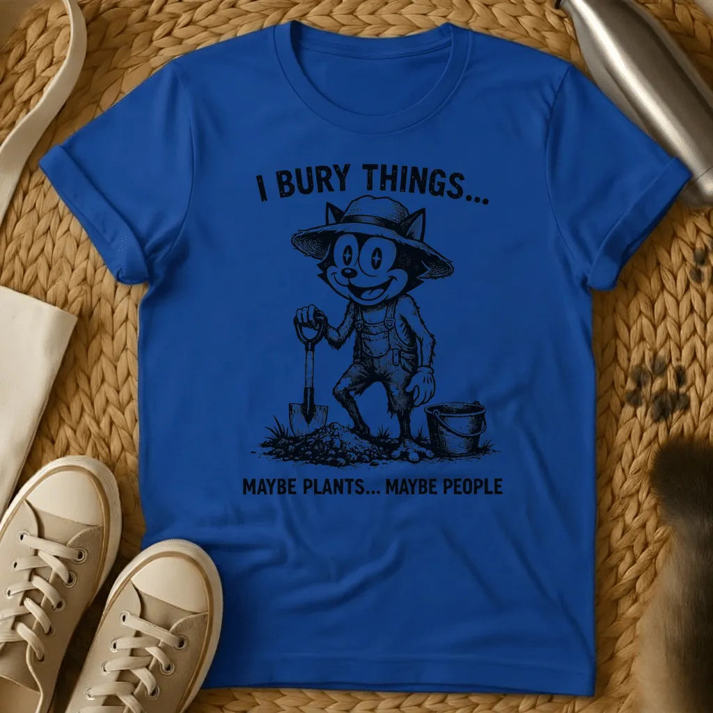 Royal - Vintage-style graphic tee featuring a grinning cat character in gardening clothes holding a shovel with text "I bury things... maybe plants... maybe p