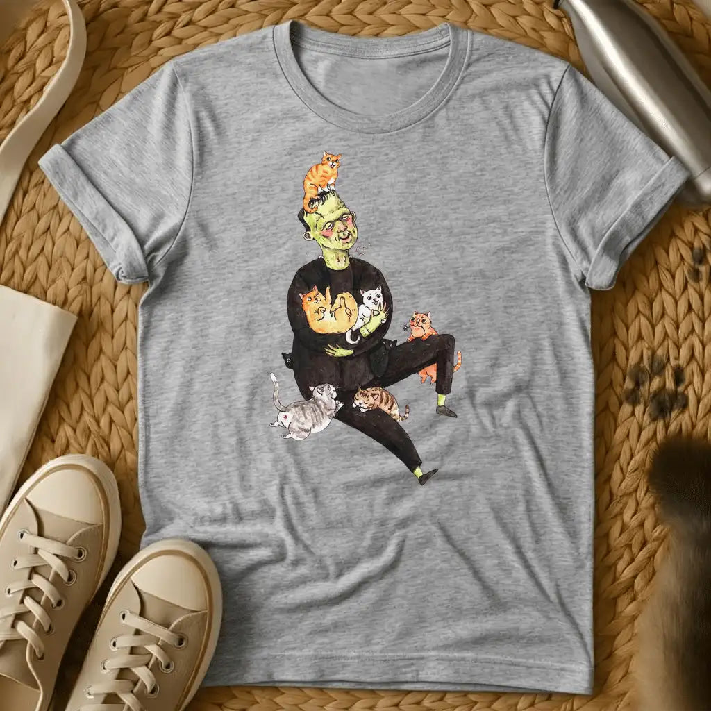 Sport Grey - Frankenstein's monster juggling colorful cats on a sage green t-shirt with whimsical cartoon illustration style